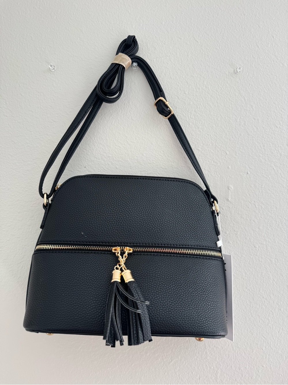 Pebbled Black Tassel Crossbody Bag with Gold Accents